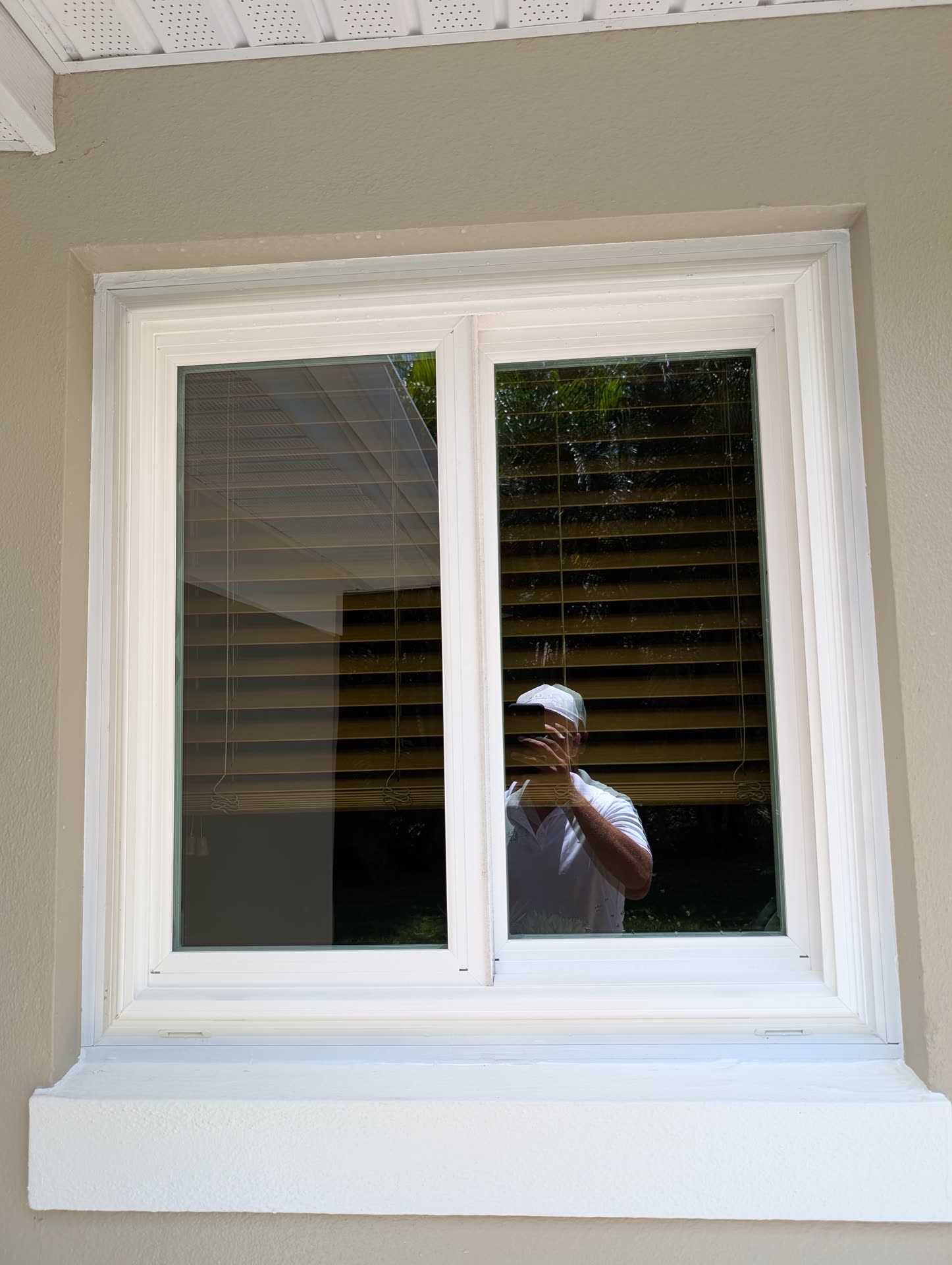 Crystal-clear glass reflecting the Florida sky after a LUX window cleaning